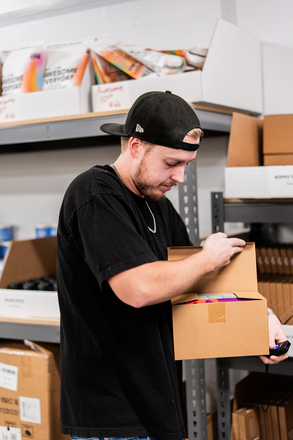 Uptime team member checking a packed ecommerce order before it ships