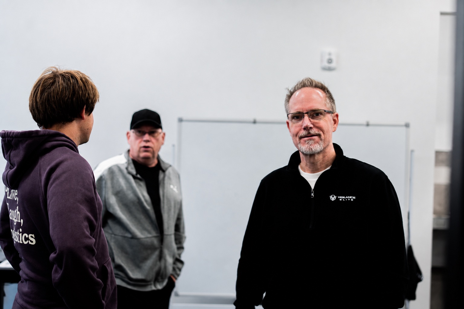 Uptime Fulfillment founder and team talking in the Draper, Utah warehouse office